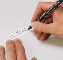 Man writing on a PVC Waterproof Removable ID Label from a Explorer 1913 case