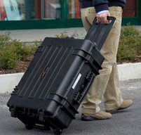 A man pulling an explorer 5823 cases using its Wheels and Telescopic Handle