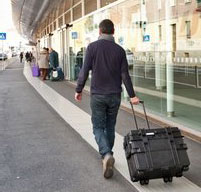 a man traveling wheeling a explorer 5140 tool case