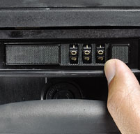 a close up of a hand using a peli 1495 laptop case 3 dial combination lock