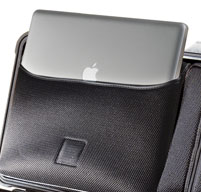 a close up of a Peli 1510LOC Laptop Overnight Case with a silver apple mac inside