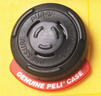 Close up of a automatic pressure equalization valve the wording balance pressure, keep water out on a yellow Peli case