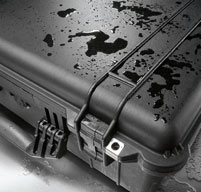 a close up of a Peli 1560LOC Laptop Overnight Case with water on the lid to show its watertight