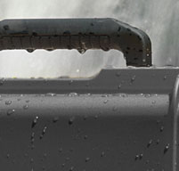 close up of a storm case near a waterfall to show how waterproof it is